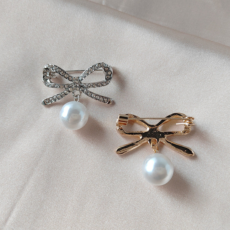 Butterfly brooch accessory displayed on fabric - Image 9