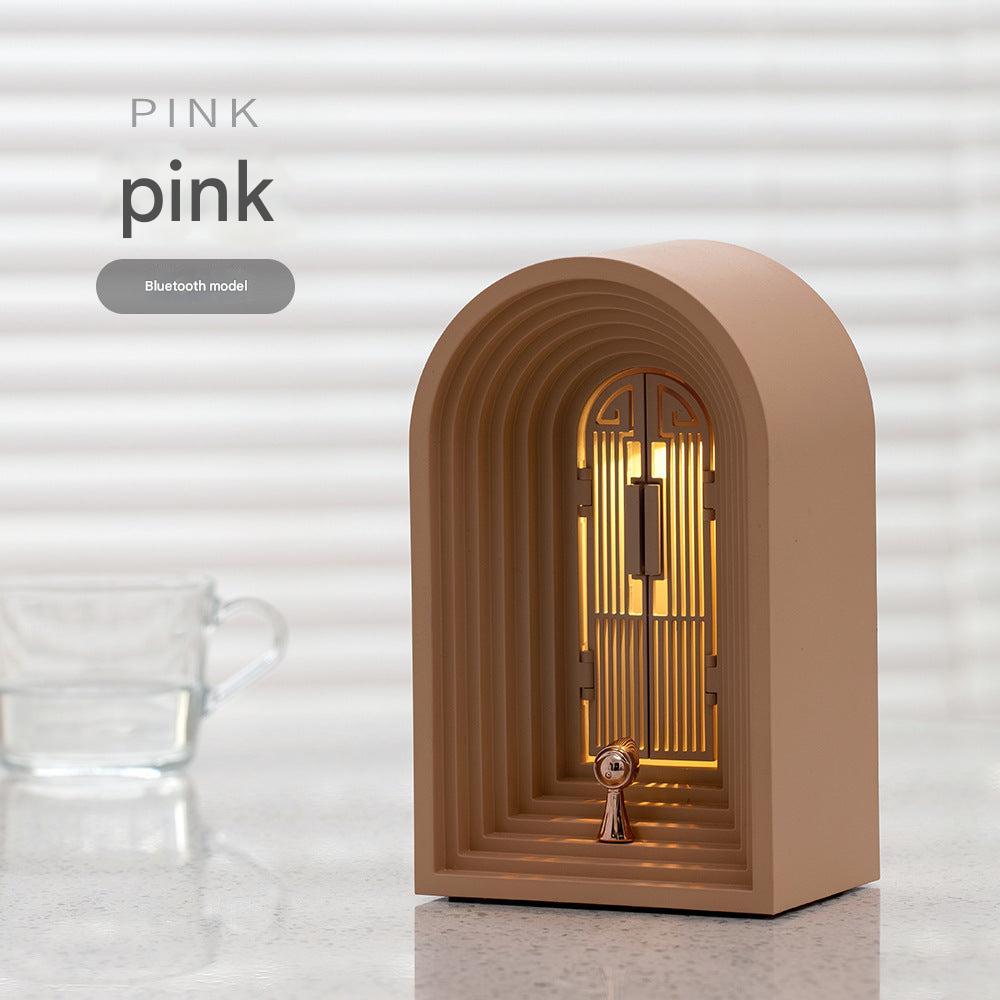 sleek bedside lamp with integrated speaker