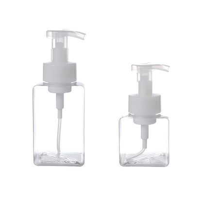 transparent cosmetic bottle on white