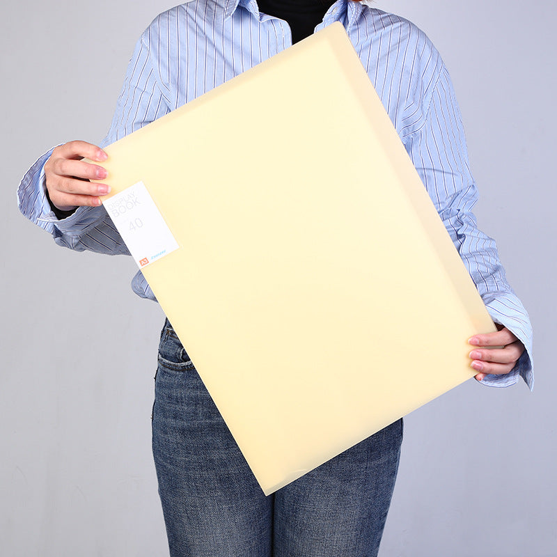 Person carrying A3 art portfolio folder outdoors