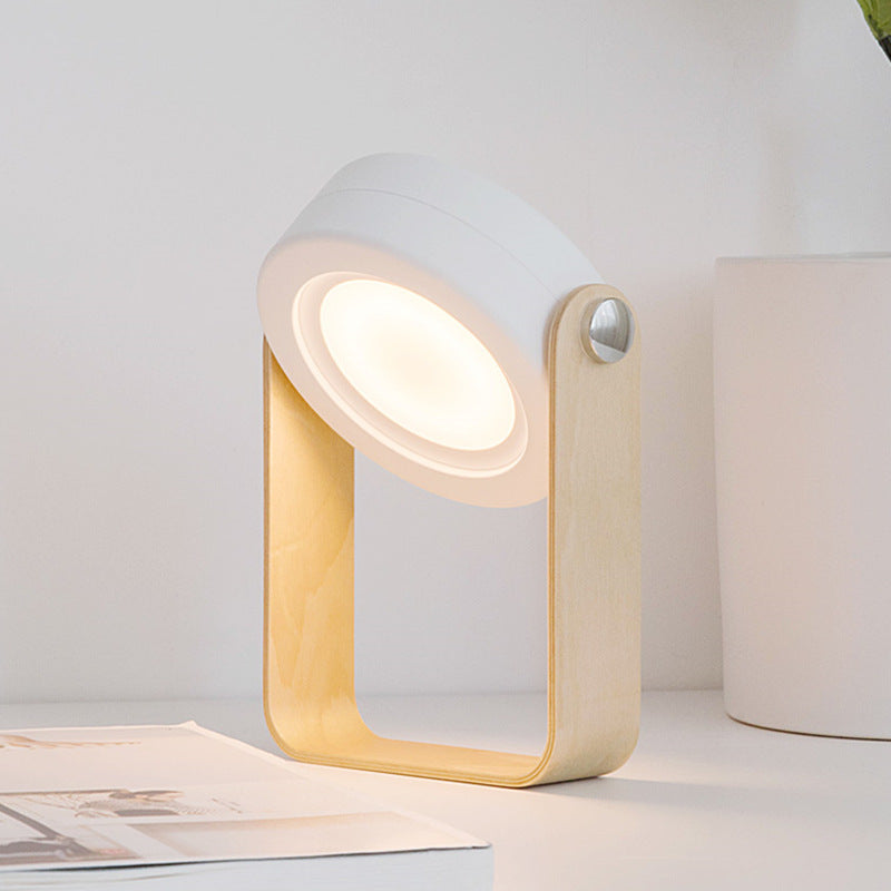 Foldable LED lantern lamp on wooden desk