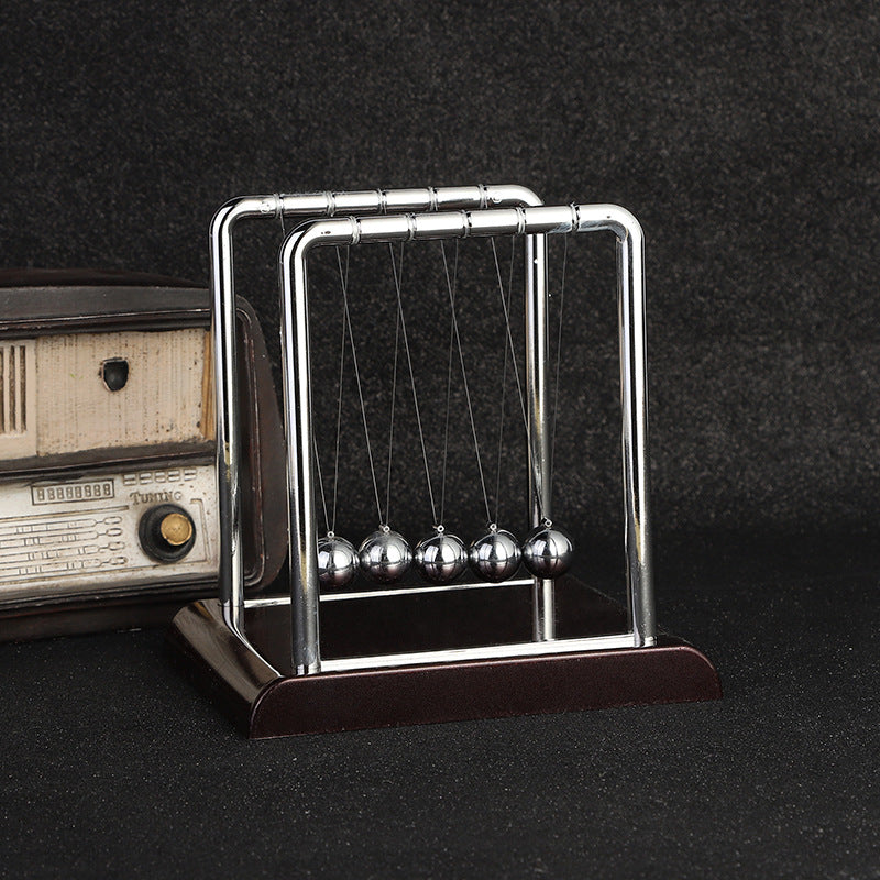 View of medium-size Newton's Cradle on office desk