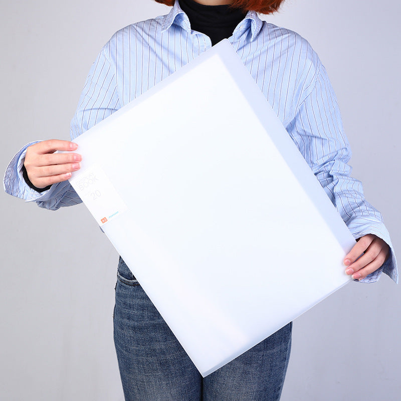 Person carrying A3 art portfolio folder outdoors