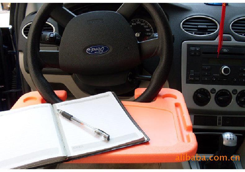 grey car desk mounted on steering wheel