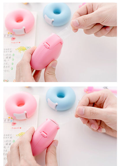 cartoon heart and donut tape dispenser on desk