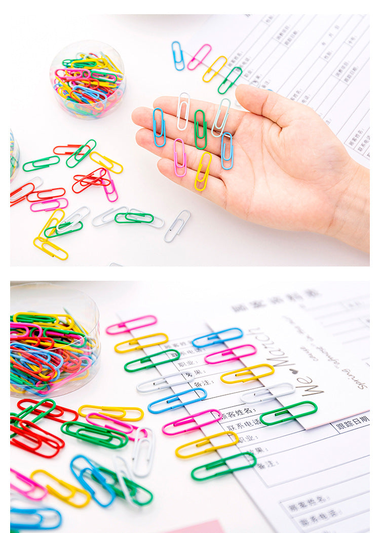 Multicolor paper clip on white background