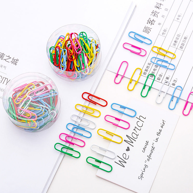 Assorted colorful paper clips top view