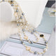Gray White Hollow Flower Pearl Sweater Chain