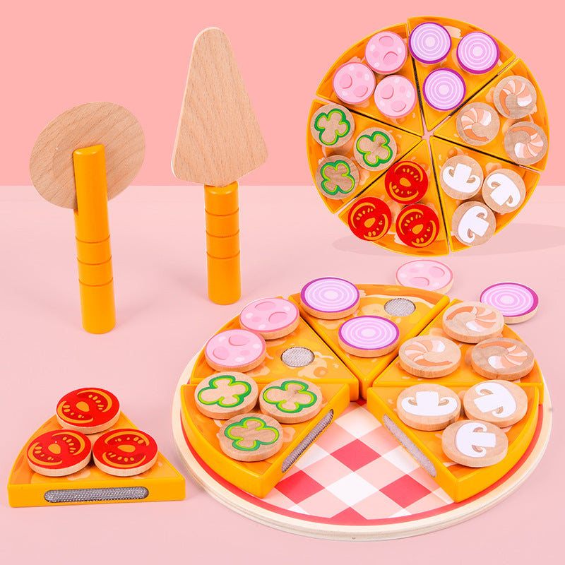 Child playing with colorful wooden pizza set