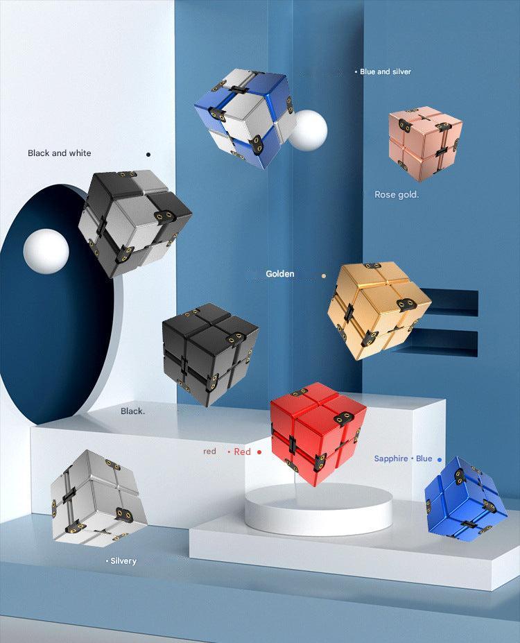 user engaging with patterned metal stress cube