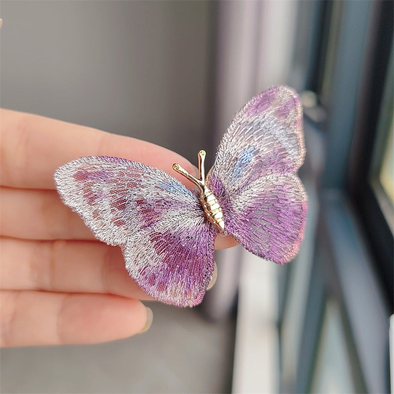 Close-up of butterfly brooch design