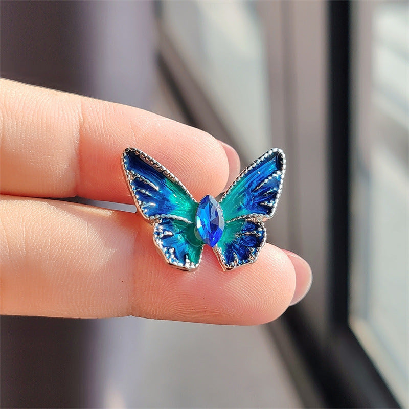 Colorful crystal butterfly brooch on jacket