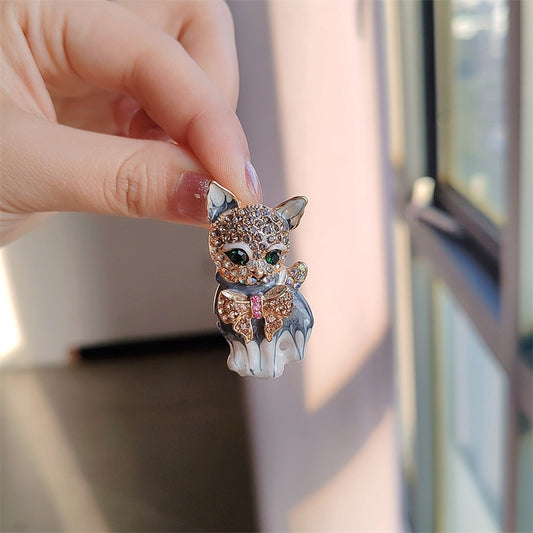 Stylish alloy cat brooch pin on white background