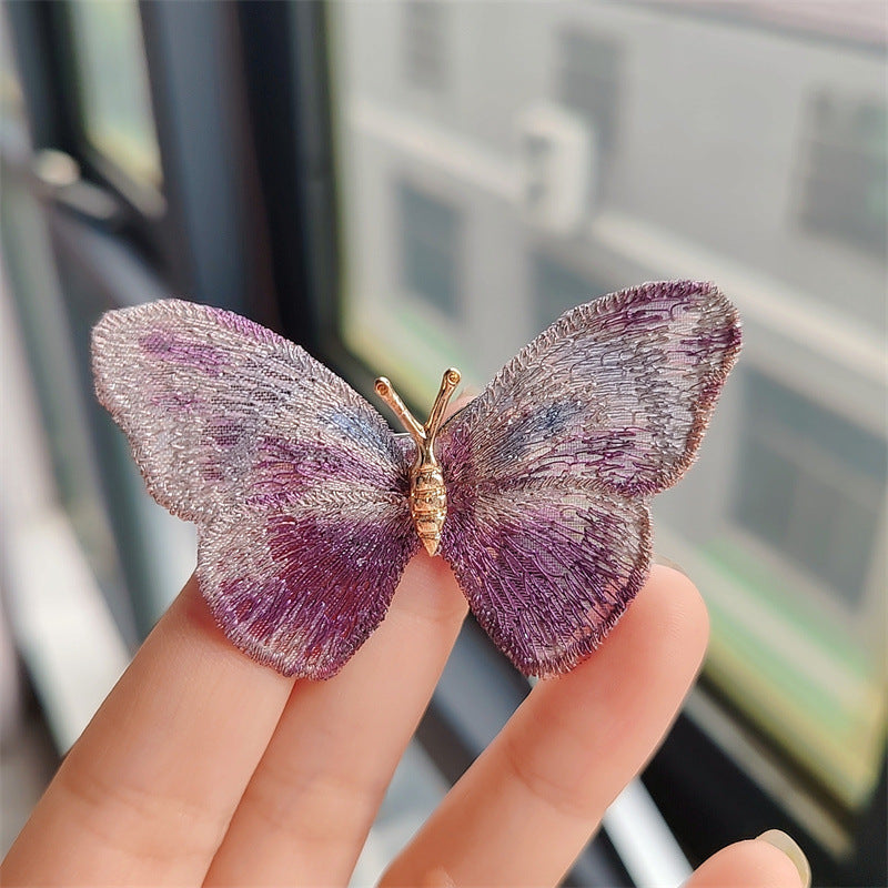 Fashionable butterfly brooch on scarf