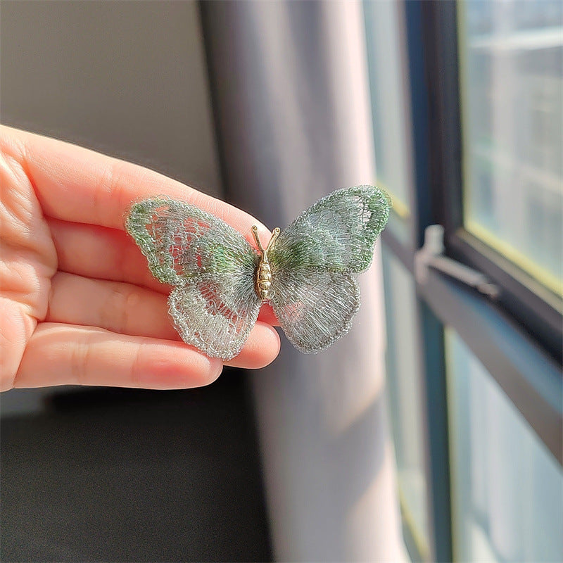Butterfly embroidered brooch in green