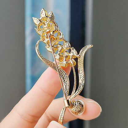 Close-up of sunflower brooch for women