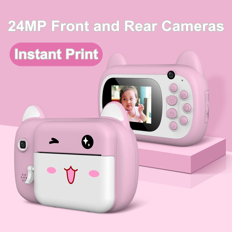 green instant camera with child in background