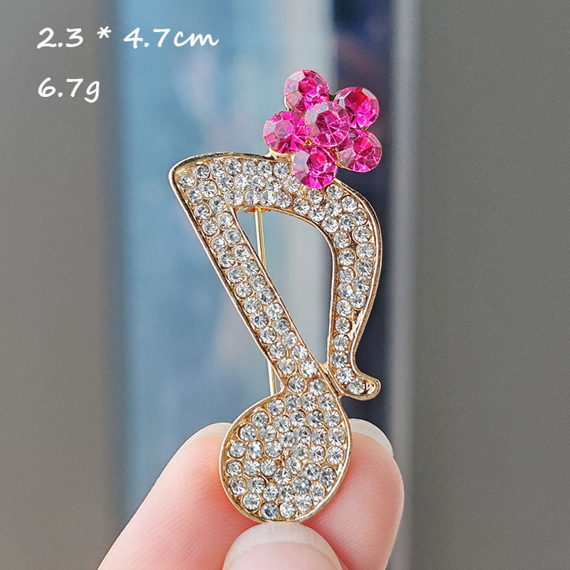 Heart-shaped musical note brooch design