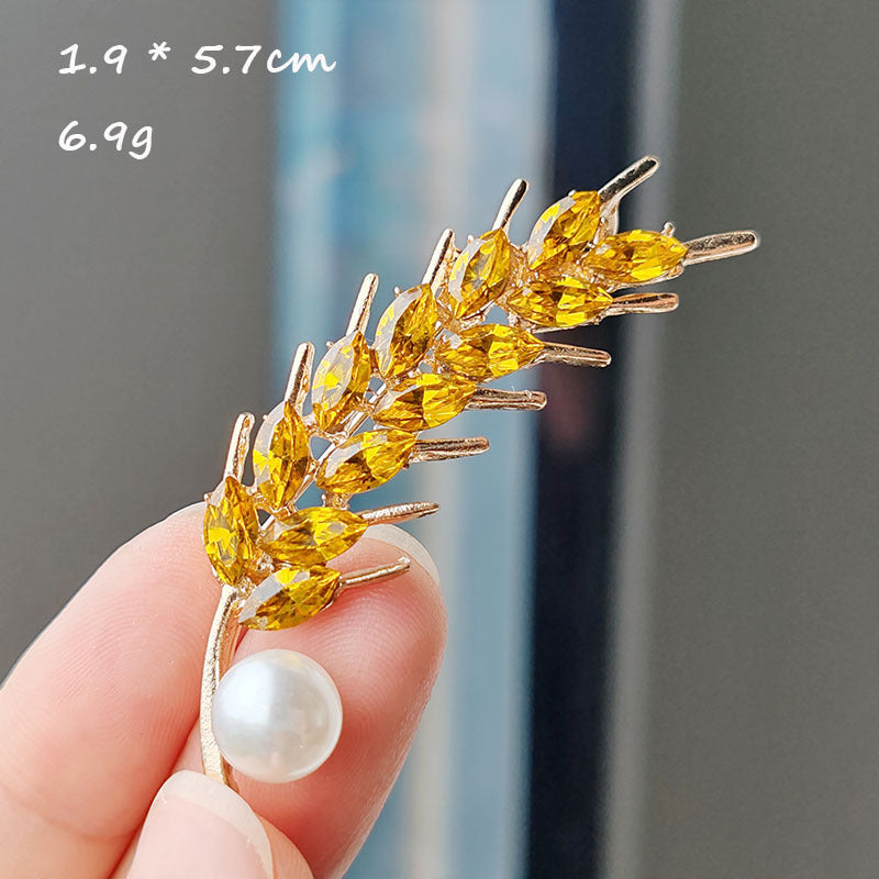 Close-up of sunflower brooch for women