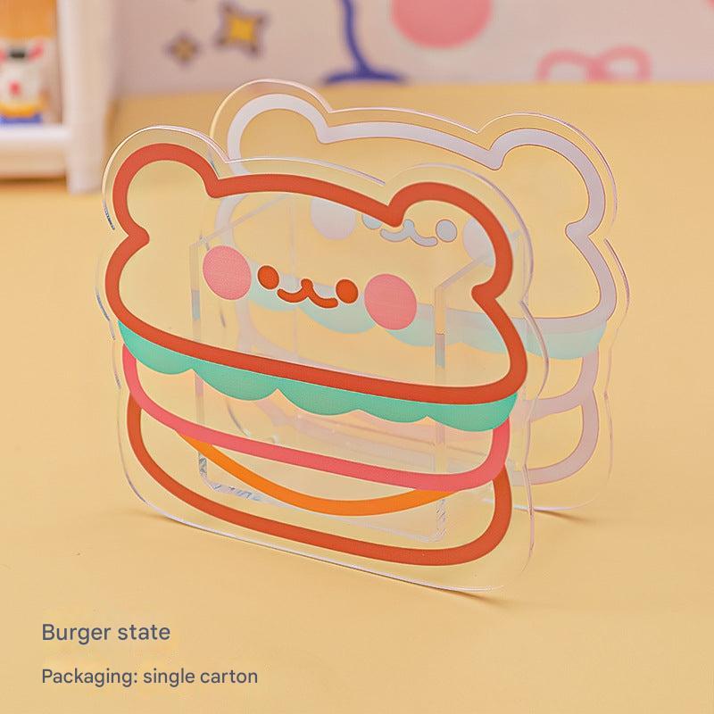 Playful desk organizer in clear acrylic with hamburger emblem