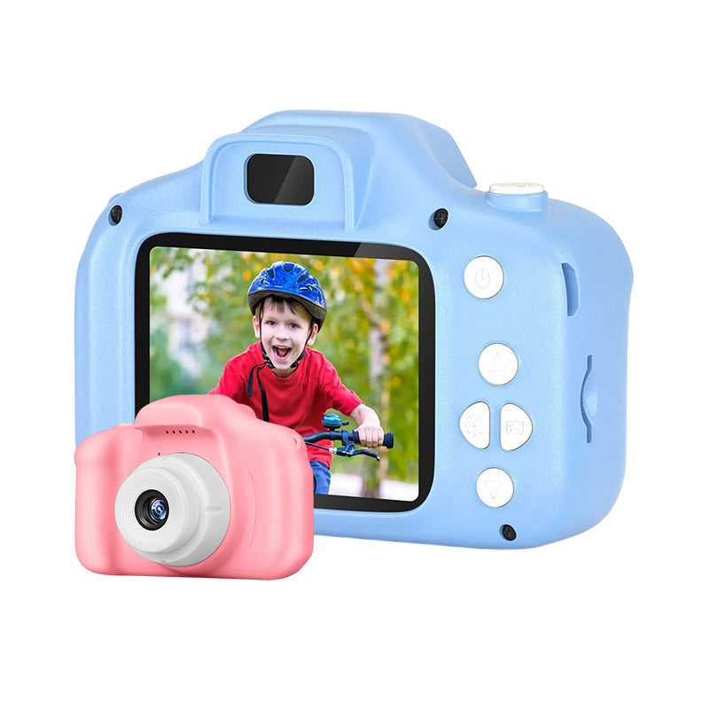 child examining photo from pink instant camera