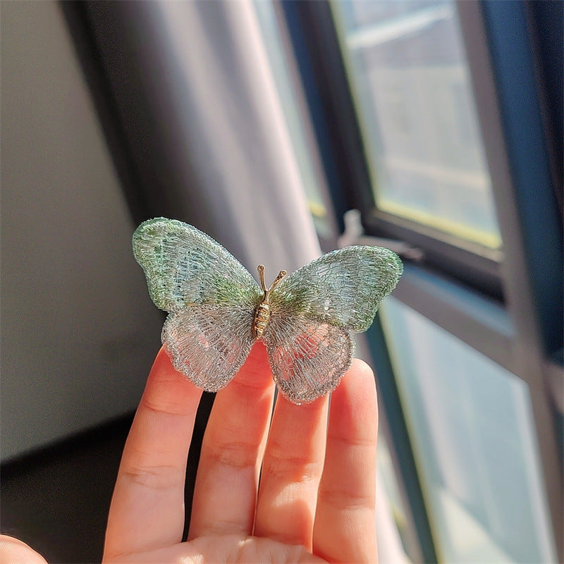 Close-up of butterfly brooch design