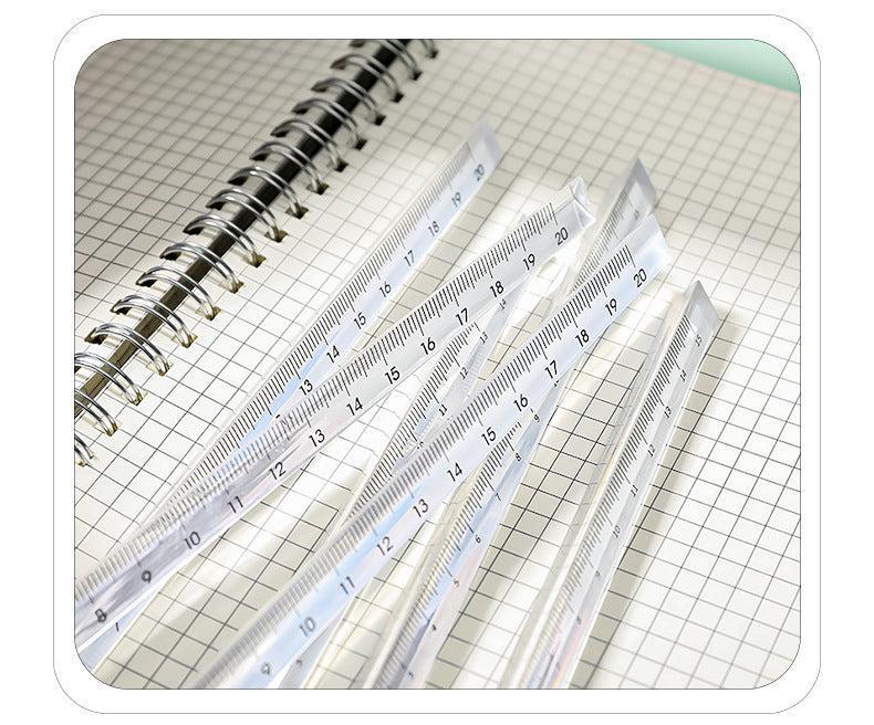 student using clear acrylic triangular ruler