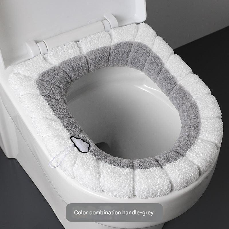 grey plush toilet seat cover with button