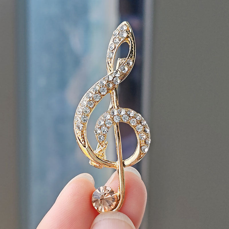 Heart-shaped musical note brooch design