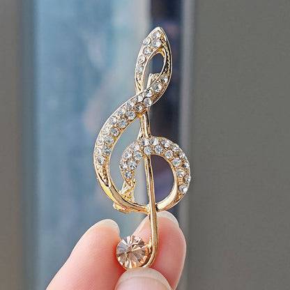 Heart-shaped musical note brooch design