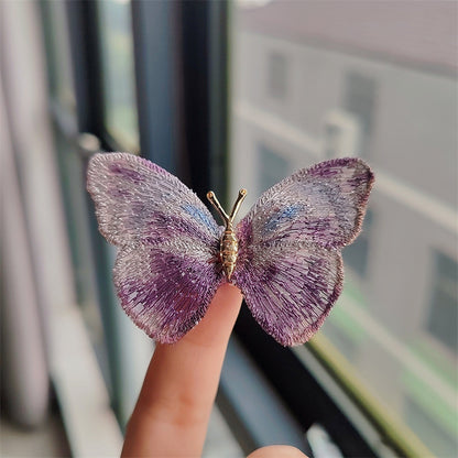 Fashionable butterfly brooch on scarf