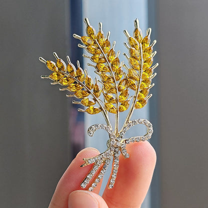 Stylish crystal wheat spike brooch on a jacket