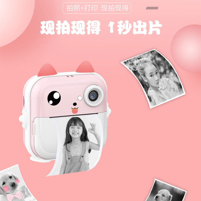 pink mini instant camera with printed photos