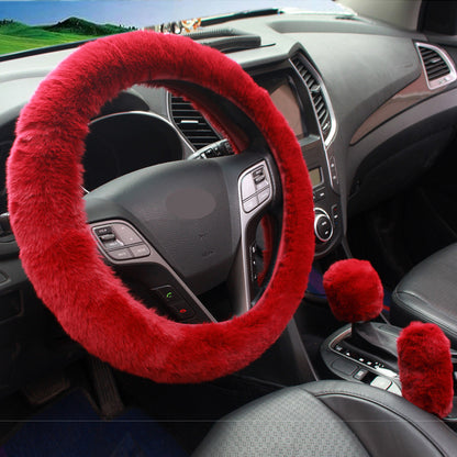 plush pink steering wheel cover in car